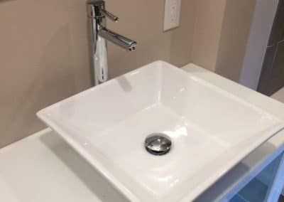 New square white sink with sleek faucet