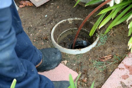 sewer drain cleaning with auger