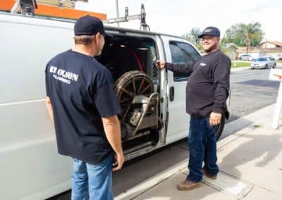 RT Olson Plumbing Truck and two plumbers