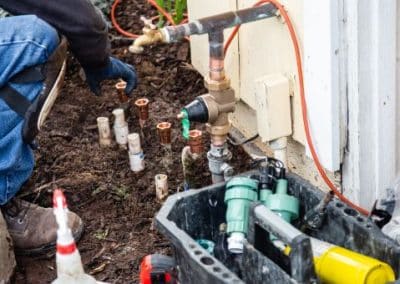 sprinkler re-pipe - plumber at work