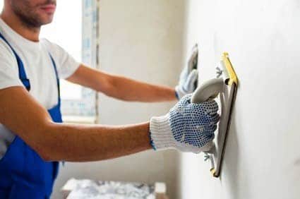 plasterer repairing drywall