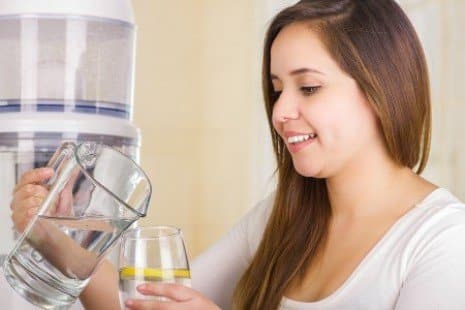 woman enjoying clean filtered water