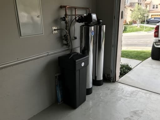 water softener and whole house water filter installed in garage