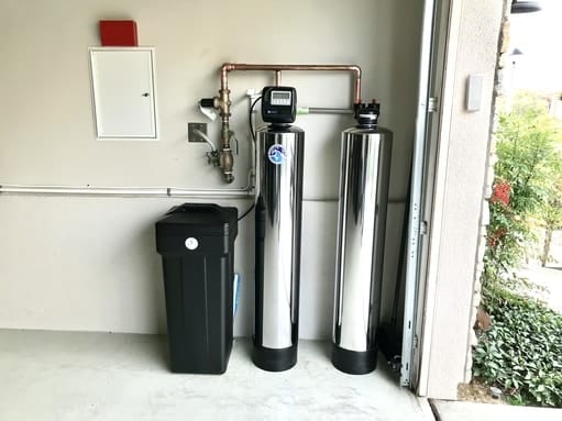 water softener and filtration system installed in garage